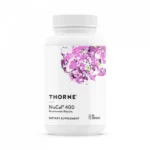 Thorne NiaCel® 400 bottle with a vibrant splash of pink and green, highlighting the dietary supplement's nicotinamide riboside content for NAD+ support.
